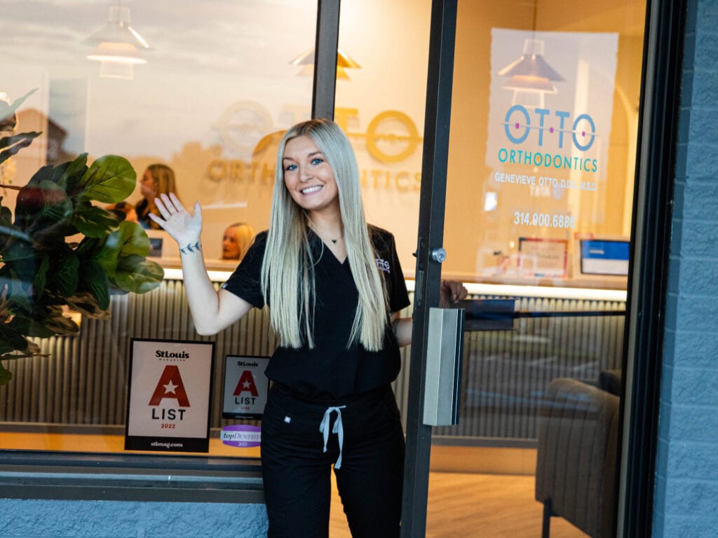 Team member smiling outside of the St. Peters location